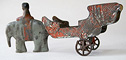 antique toy elephant with a cart